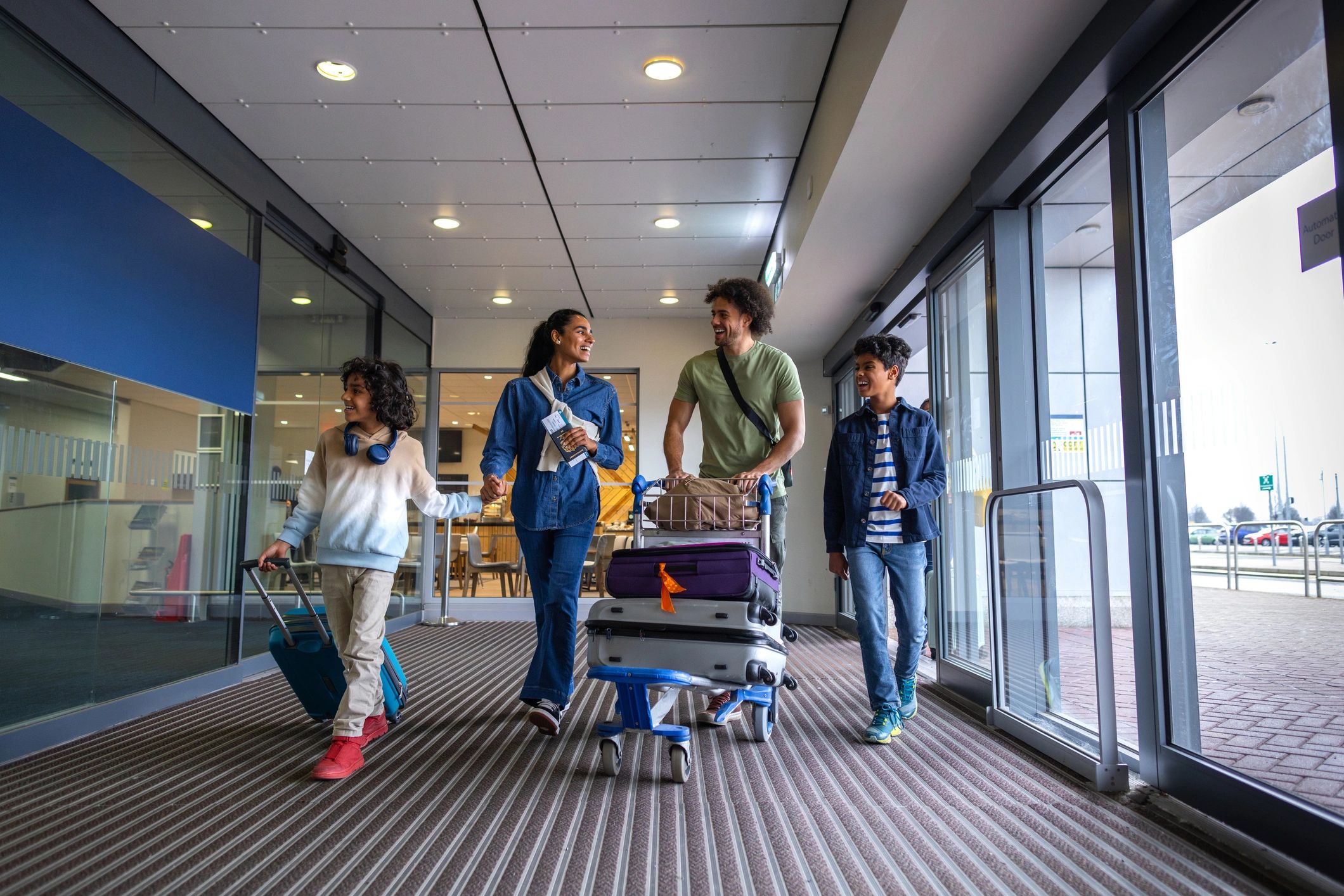 Family arriving at the airport with luggage